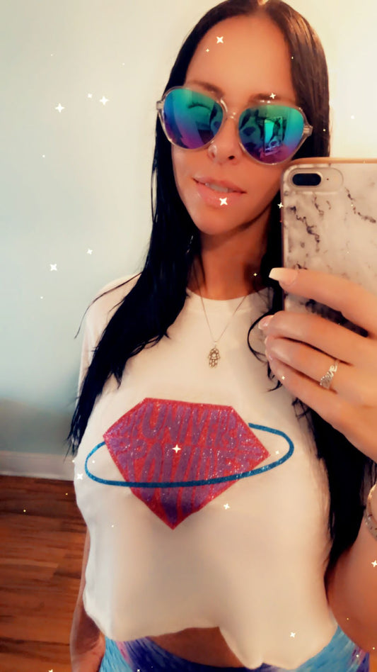 The universe provides White crop tee and purple logo